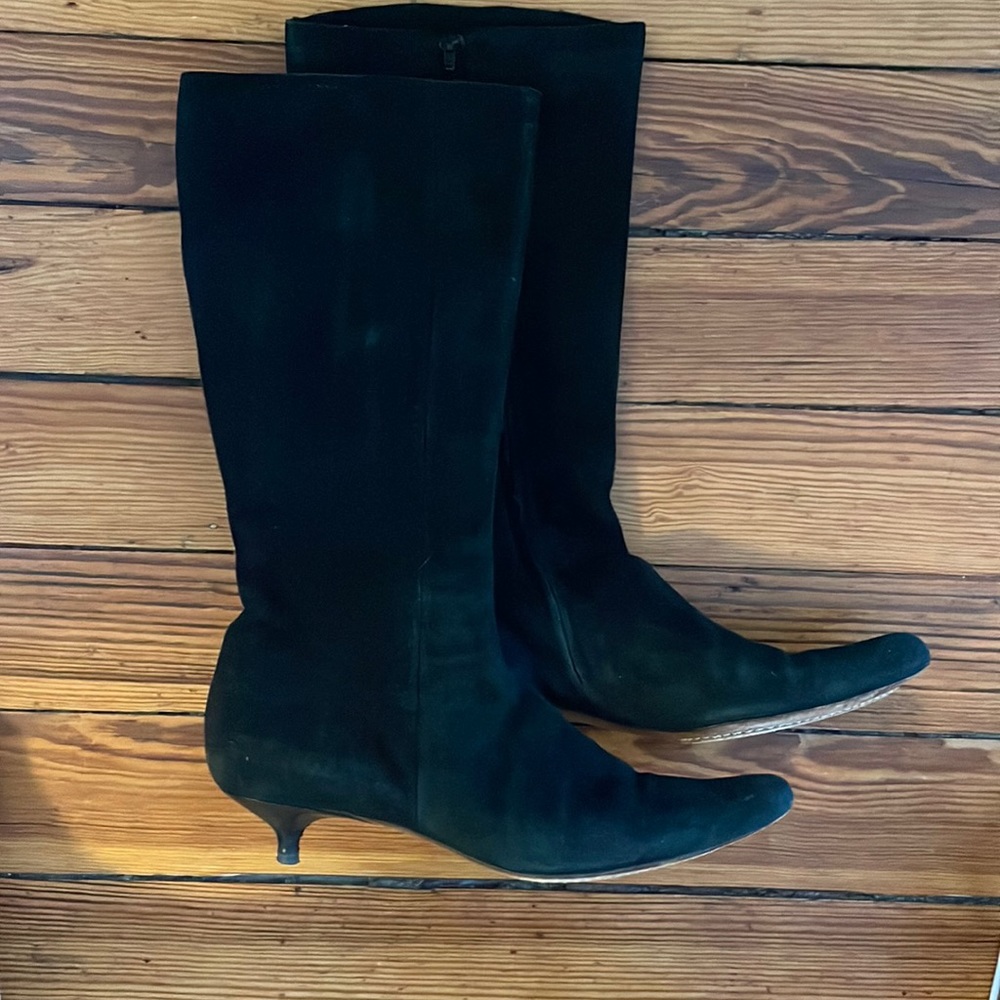 Black suede zip-up boots.